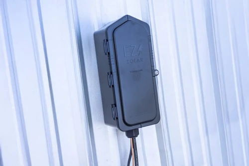 Tombstone PV junction box for metal roof